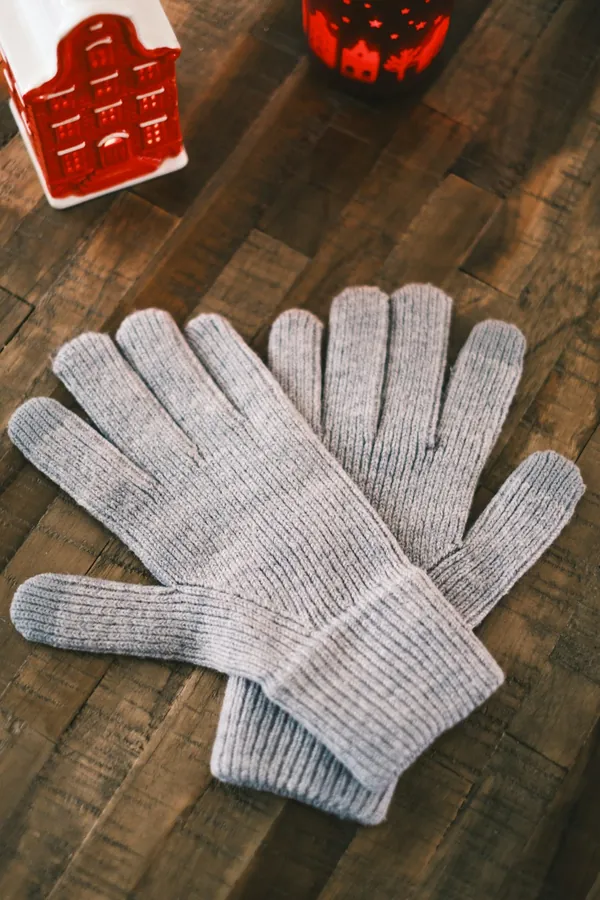 Pair of grey knitted gloves