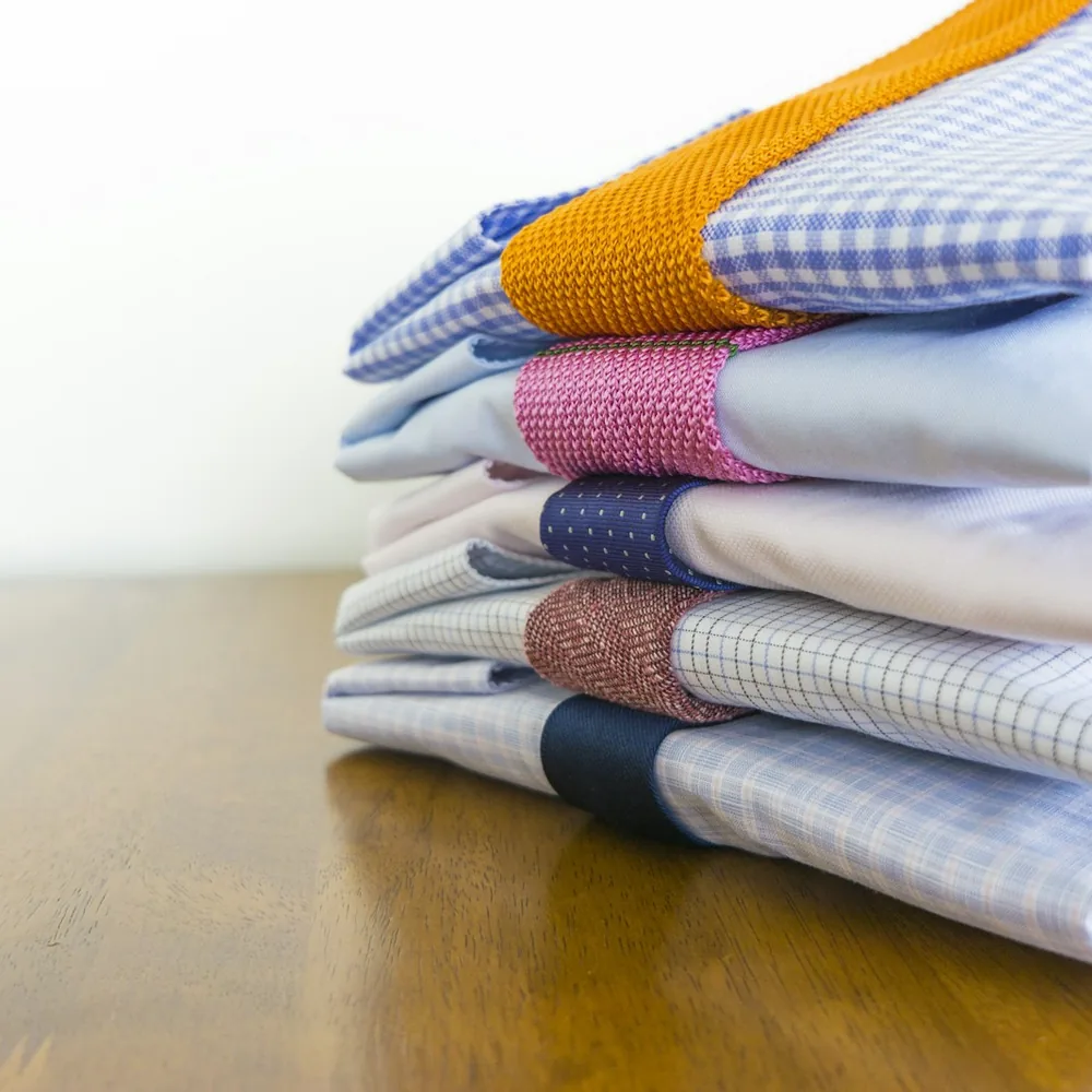 Stack of folded yarn-dyed woven shirts