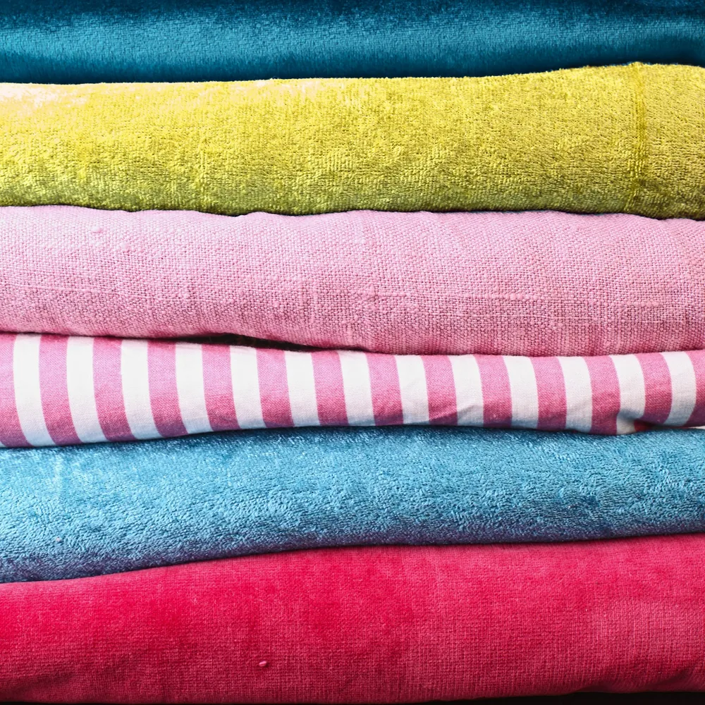 Stack of folded towels in bright colours