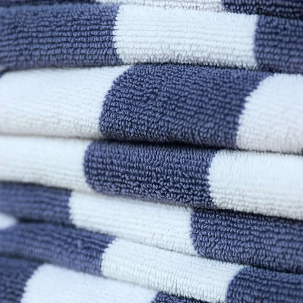 Folded yarn dyed pool towels with navy and white stripes